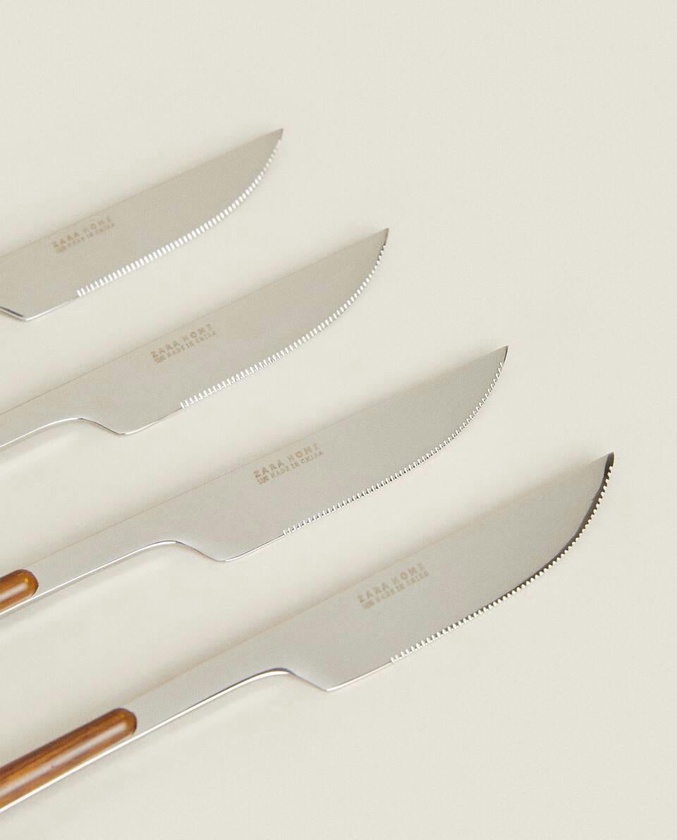 BOX 4 KNIVES WITH ROUND HANDLE DETAIL
